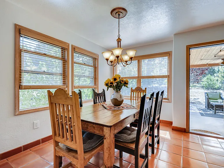 Sun filled indoor dining area ... looking to the outdoor portal seating area