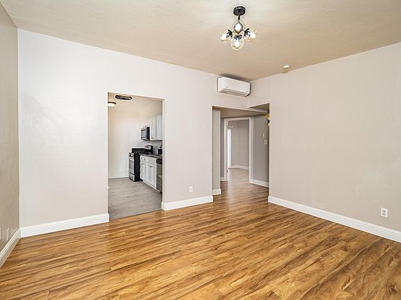 Living room view towards kitchen and bedrooms
