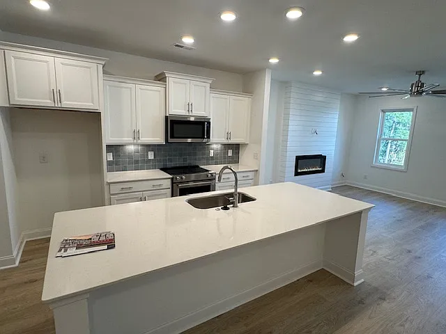 Kitchen with top-line appliances and French-door refrigerator coming