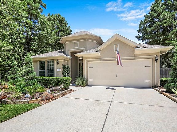 Luscious landscaping with natural borders and healthy shade trees.