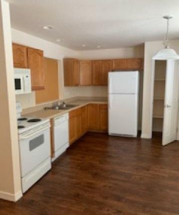 Eat in kitchen with stoge, microwave, dishwasher and refrigerator provided. Pantry. Lots of natural light in kitchen nook