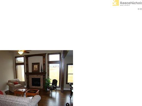 Plenty of natural lighting in Great Room with fireplace