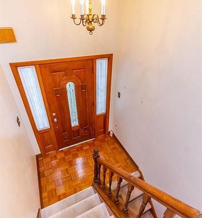 Parquet floors in foyer/entry.  There are hardwood floors under the carpet throughout the main floor.