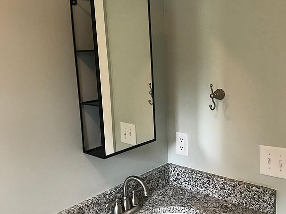 Vanity mirror with side access for belongings