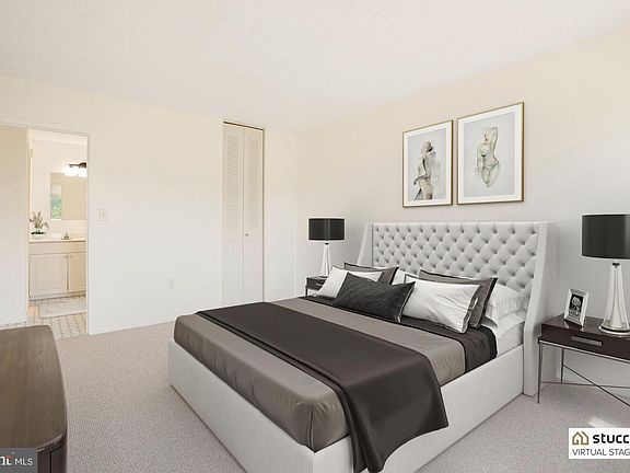 Large bedroom with new carpet and walk-in closet.