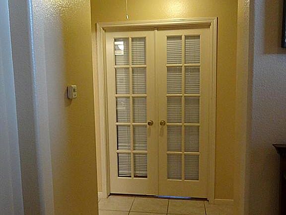 Study located right off of the entry with French doors