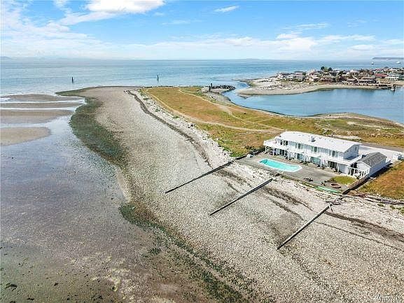 Aerial view of condo building, South Cape Point and harbor.