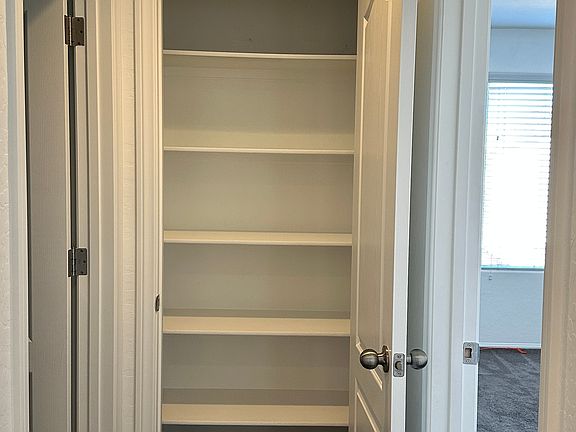 Linen Closet next to Laundry Room