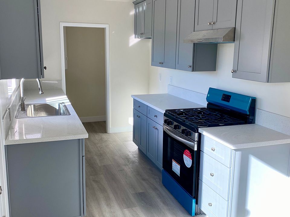 Newly updated kitchen cabinets, countertops, and stove/range
