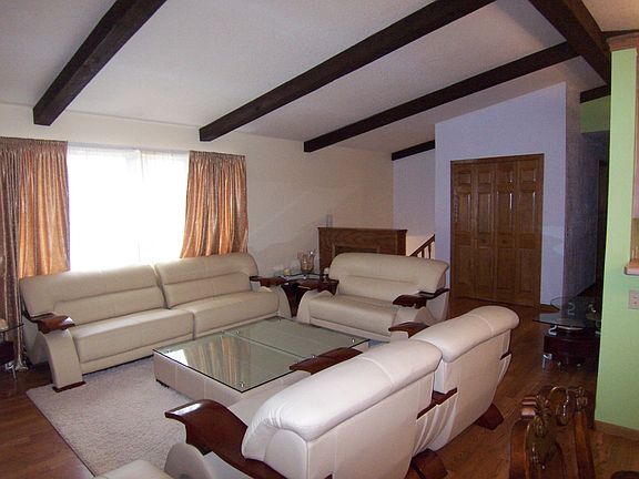 Vaulted living room with har