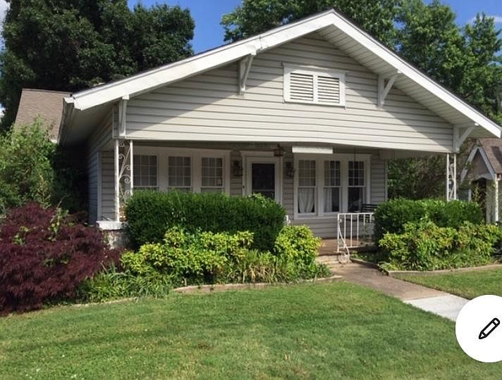 Front of house with beautiful landscaping that provides color year-round. Landlord takes care of all landscape.