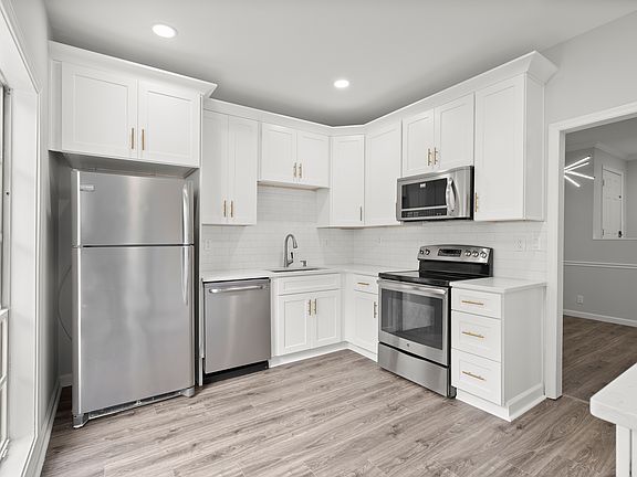 Renovated Kitchen with large daylight window. Large 42in cabinets for extra storage and and quartz countertops. (large floor to ceiling pantry not show in picture)