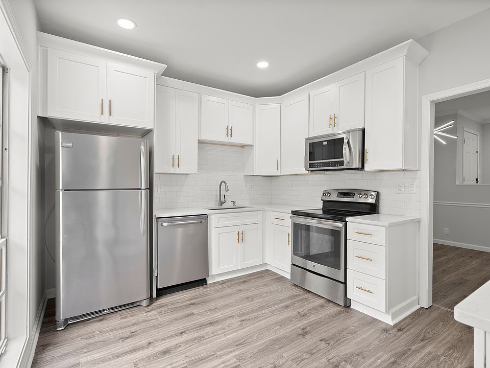 Renovated Kitchen with large daylight window. Large 42in cabinets for extra storage and and quartz countertops. (large floor to ceiling pantry not show in picture)