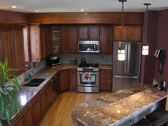 Newly renovated kitchen w/ stainless appliances and granite counter tops