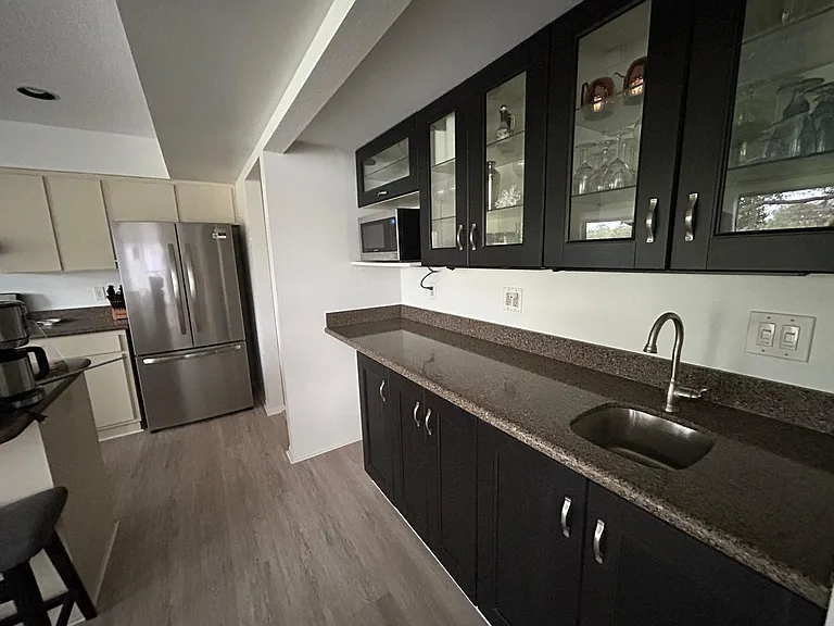 Extended kitchen counter with bar sink