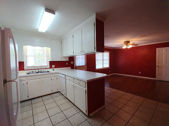Kitchen open to the den which could also be used as the dining room