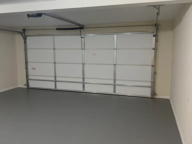 Spacious two car garage with newly resurfaced floor