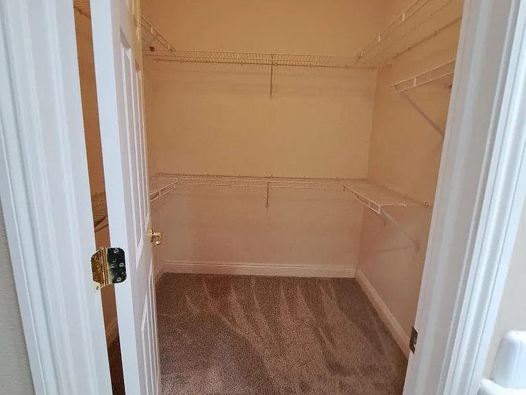 Walk in master bedroom closet