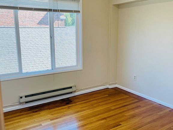 Bedroom with hardwood floors and full wall closet
