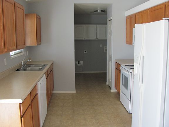 Kitchen/laundry room in background