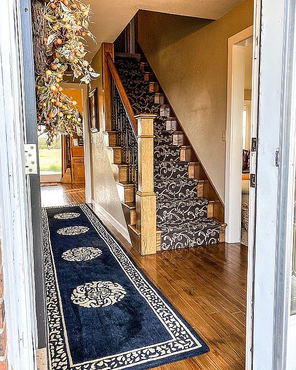 Walking in front door. 