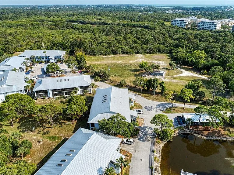 Secluded, yet central. __ From above, you can see the sea of green that wraps around our community. Enjoy the privacy of the preserve while being just minutes away from Englewood's best beaches and golf courses.