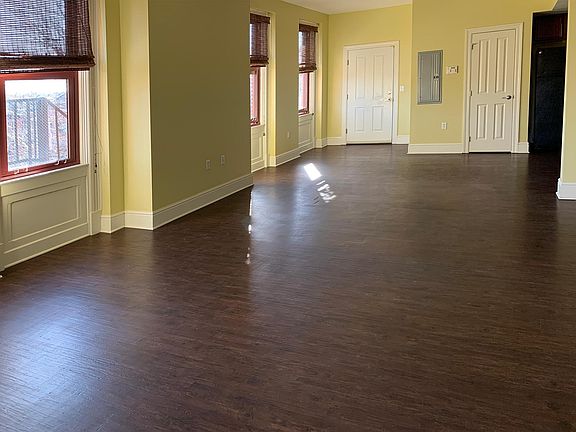 View from the bedroom of the open-plan living, kitchen, and dining room