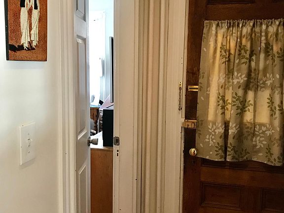 Door to living room (can function as second bedroom or office space)