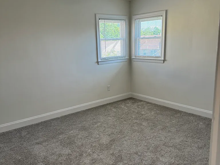 Lots of natural light and a ceiling fan in bedroom #2.
