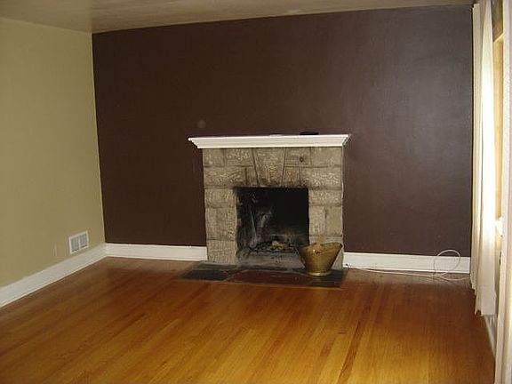 Living room with wood burning fire place