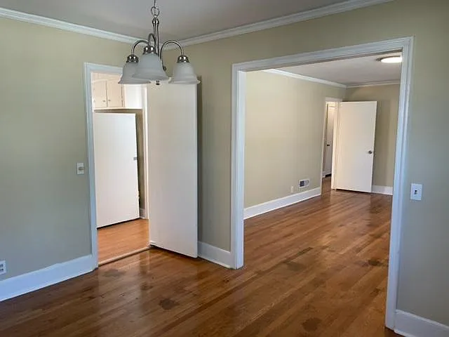 View from dining room to kitchen and living room. New lighting fixtures.