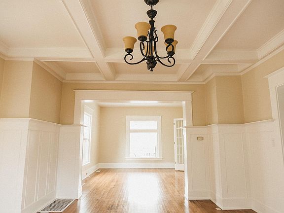 dining room with coffered ceilings