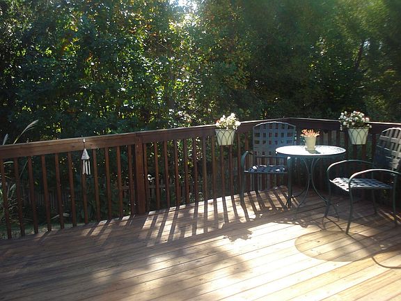 Huge deck & extensive landscaping & garden areas