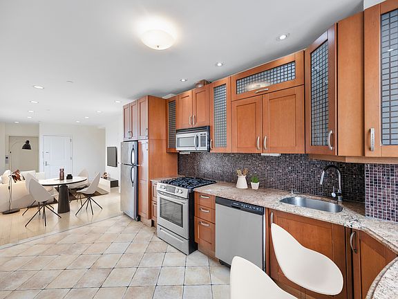 a room filled with furniture and a large window