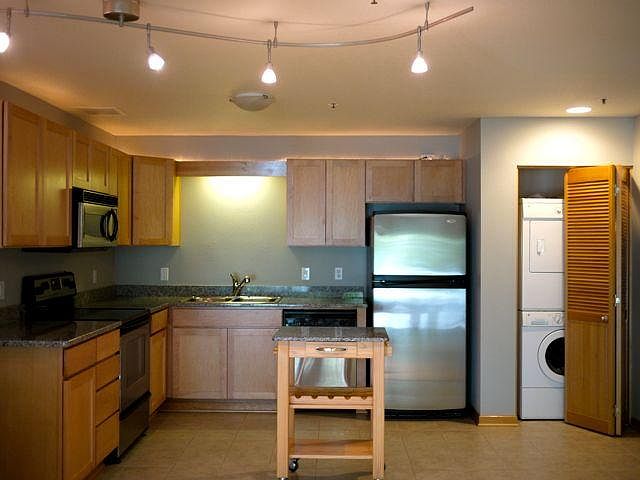 Gourmet kitchen has stainless steel appliances, granite coun