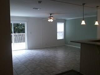 Living Rm with view back deck-tiled