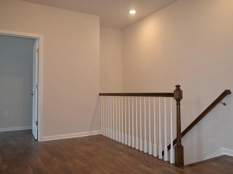 View the entry of the master bedroom and the steps to the first floor.
