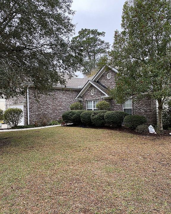 Front yard with live oaks