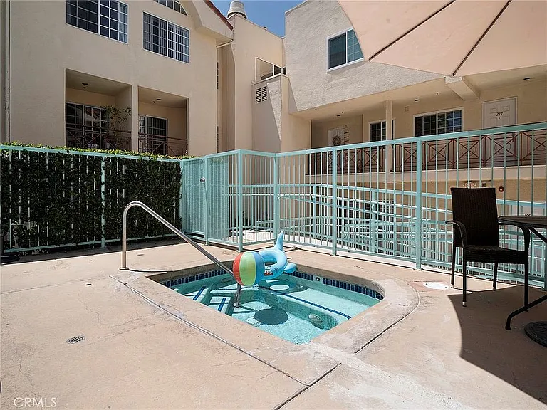 Fenced hot tub.