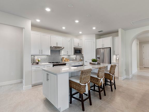 Model Representation Gourmet kitchen with stainless steel gas appliances 42 white maple cabinets