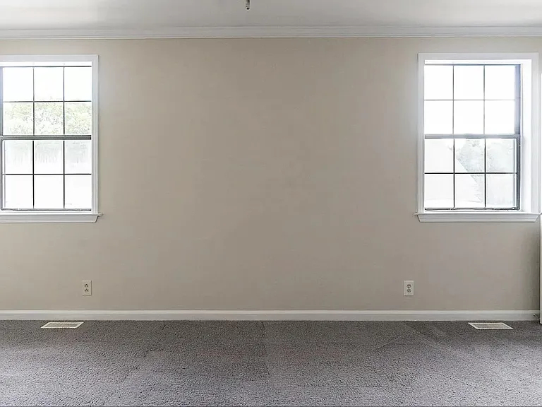 Please note that the carpet has been removed and replaced with hardwood floors.