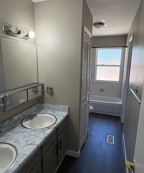 Upper level complete bath with double vanity and linen closet.