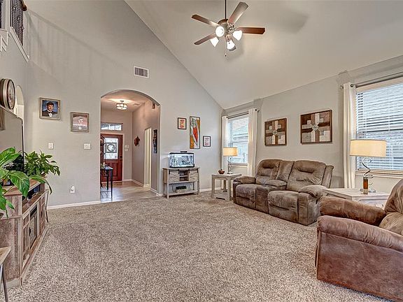 Large open concept living area with large windows and plenty of natural light.