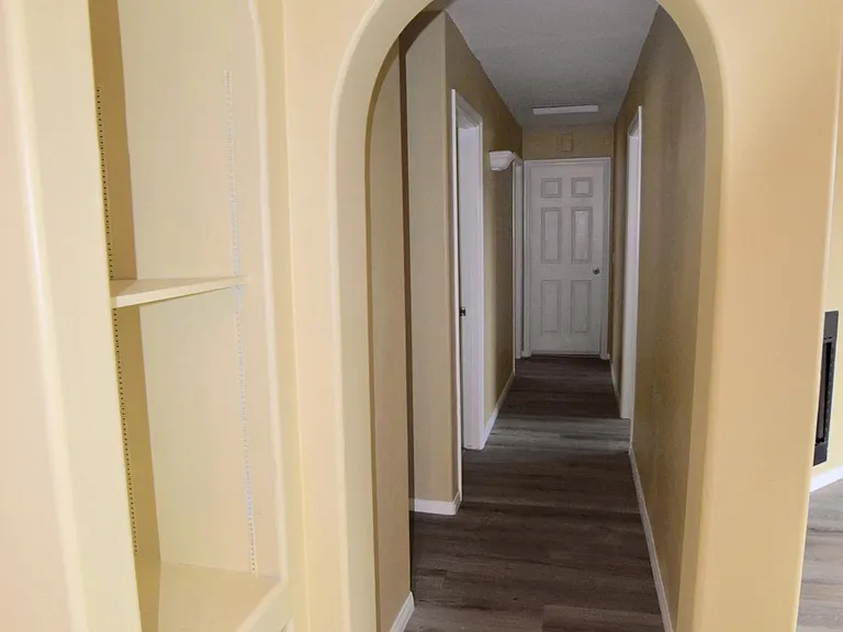Hallway to Bathroom, 3 Bedrooms, and Garage