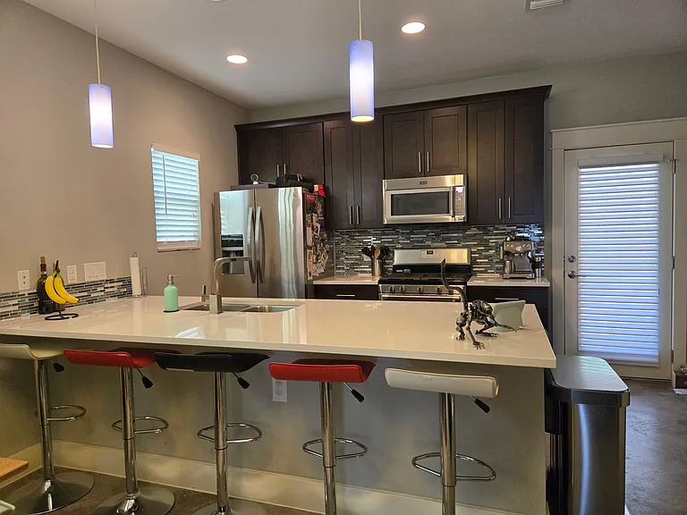 Kitchen view with extended bar