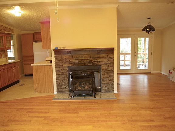 Living room view into kitchen and dining room