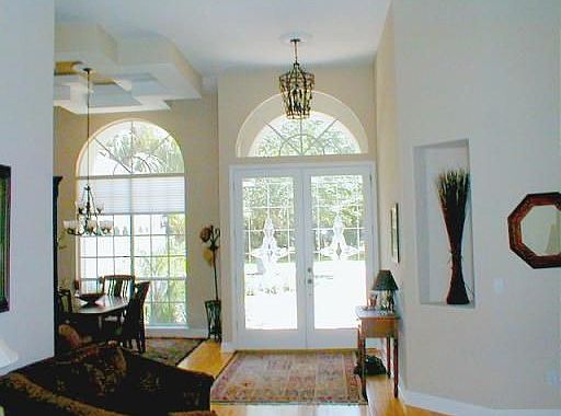 The exquiste windows in the Formal Dining Room illuminates the room by day