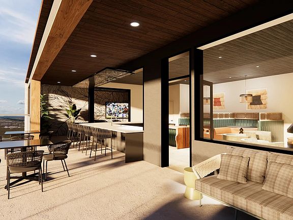 Rooftop sky lounge with an indoor/outdoor covered patio with views of the downtown Dallas skyline and Deep Ellum.