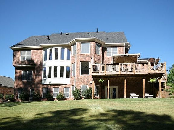 This YARD is level, neat and Landscaped with Well Over 1 ACRE!