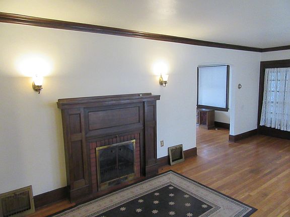 Fireplace French door leads to summer porch.